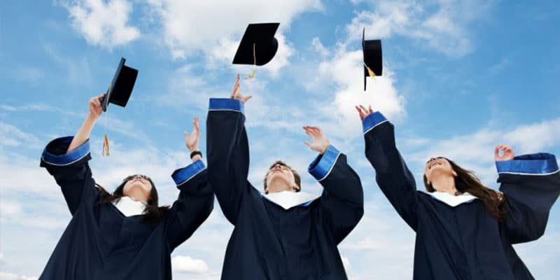 Graduates throwing caps